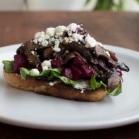Mushroom & Beet Toast · With slow-cooked shiitake and portabella mushrooms. Served on pain levain and smeared with h...