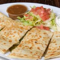 Quesadillas · Grilled flour tortilla loaded with pepper-jack cheese, green peppers, and onions. Served wit...