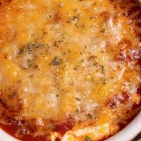 Baked Goat Cheese Marinara · Creamy goat cheese coated in bread crumbs, covered in marinara sauce, topped with Asiago che...