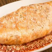 Calzones · Oven-baked folded cheese pizza, put on top of a plate of marinara sauce, and brushed with ga...