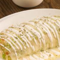 Smothered Steak Burrito · A huge burrito stuffed with your choice of meat, refried beans, lettuce, tomato, cheese, sou...