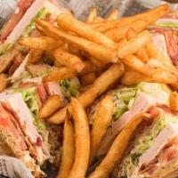 Turkey Club Sandwich · Thinly sliced smoked turkey, Swiss cheese, bacon, lettuce, tomato, and mayo on multi-grain o...