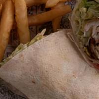 Chicken Tender Wrap · Crispy Chicken Tenders, lettuce, tomatoes and Swiss cheese, topped with honey mustard.