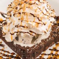 Brownie  Sundae · Warm brownie topped with rich vanilla ice cream, whipped cream, chocolate, and caramel toppi...