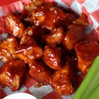 Boneless Chicken (1/2 Lb) · Half pound of boneless chicken. Choice of wing sauce. Served with ranch or bleu cheese and c...