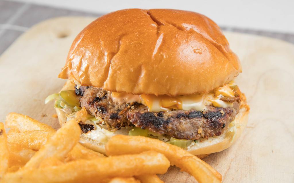 Ananas Special Burger · Our special burger includes your choice of a brioche or pretzel bun, beef patty, topped with Swiss cheese, American cheese, caramelized mushroom and peppers, pickles, coleslaw, tomatoes, grilled onions and our special burger sauce.