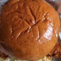 Nashville Hot Chicken Sandwich · Fried chicken breast, coleslaw, butter pickles, Nashville hot rub.