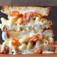 Fan Favorite! Lobster Mac Grilled Cheese · White cheddar mac and cheese topped with lobster claw meat, provolone and mozzarella cheese ...
