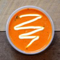 Hearty Tomato Soup Cup · Our signature creamy tomato soup topped with lime sour cream.