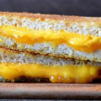 Classic Grilled Cheese · American and cheddar cheese on Parmesan sourdough.