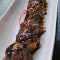 Negima App · Grilled thin sirloin steak wrapped with cream cheese & scallions topped with teriyaki sauce.