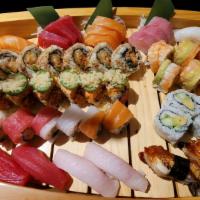 Kooma Party Tray · Ten pieces of nigiri, nine pieces of sashimi, oo7 roll; California roll, resource roll, red ...