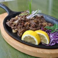 Bulgogi · Marinated thin sirloin steak grilled with onions served with steamed rice.