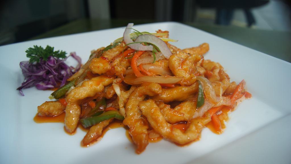 Sweet & Spicy Chicken · Deep-fried chicken breast w/stir-fried vegetables, in a spicy sweet and sour sauce.