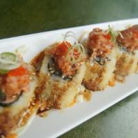 Bruno Roll · deep-fried tuna, salmon, red snapper, cream cheese & avocado roll, placed on a bed of spicy ...
