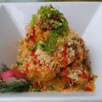 Kooma Volcano Roll · deep-fried spicy tuna w/ avocado, topped w/ special sauce, jalapeños, wasabi tobiko, srirach...