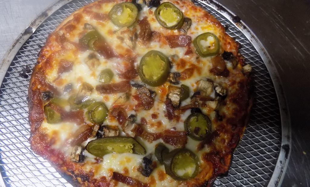 El Diablo! · Hottest Pizza In Wichita! Spicy HOT SAUSAGE, Hamburger, Canadian Bacon, “Jalapeño Pepperoni’s “, Jalapeños & GHOST PEPPER Cheese! Mixed with Mozzarella.