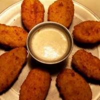 Jalapeño Poppers · 8 Fried Breaded jalapeño’s with Cream Cheese! Served with Ranch!