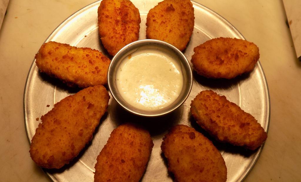 Jalapeño Poppers · 8 Fried Breaded jalapeño’s with Cream Cheese! Served with Ranch!