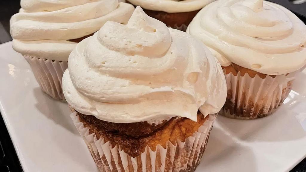 Cinnamon Rolls · Cinnamon rolls topped with cream cheese frosting.