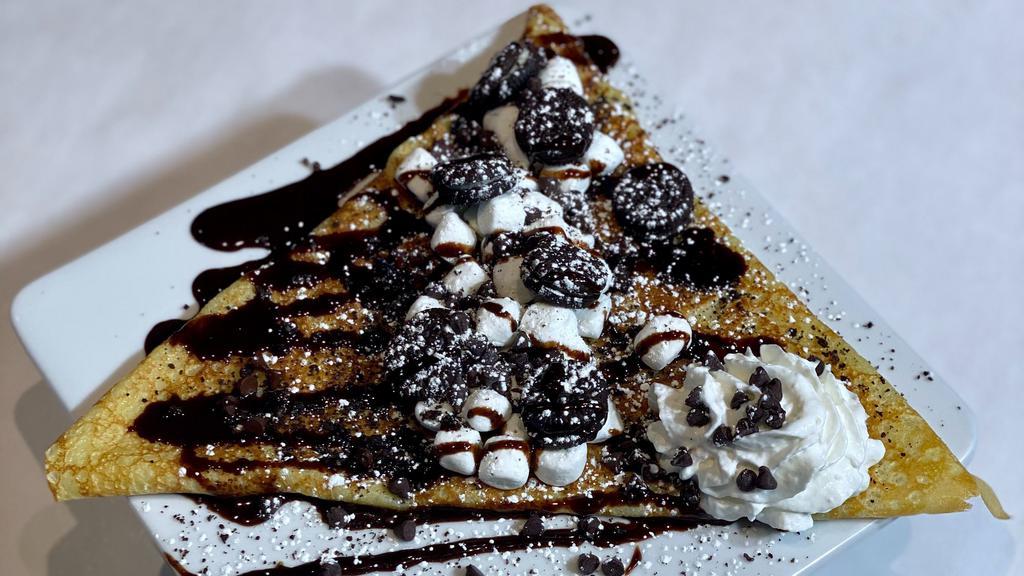Oreo Crepe  · Crepe filled with a marshmallow filling, crushed Oreos, and then topped with whipped cream, marshmallows, chocolate drizzle and crushed Oreos.
