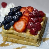 Very Berry Waffles  · Crisp waffles topped with berries, whip cream and maple syrup.