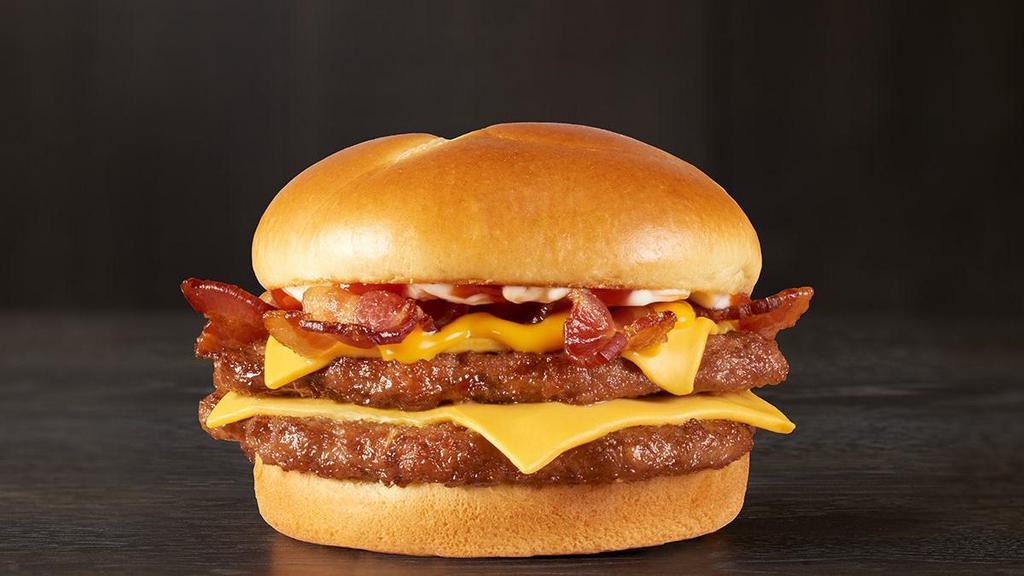 Baconzilla!® · Warning: there will be bacon. Take on these two large hand-seasoned, 100% beef hamburger patties piled high with four slices of crispy bacon, two slices of American cheese, melted cheddar cheese, ketchup and mayonnaise all served on a toasted bakery-style bun.