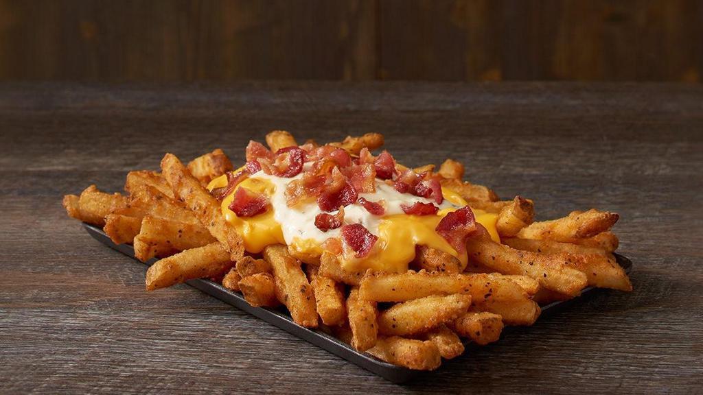 Fully Loaded Fries · Our Famous Seasoned Fries topped with cheese, ranch and crispy bacon.