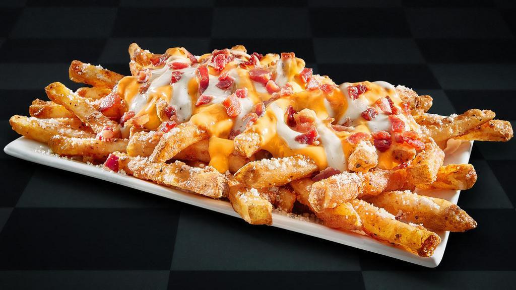 Garlic Parmesan Loaded Fries · Enjoy our Famous Seasoned Fries topped with garlic parmesan sauce and smoky bacon crumbles, then smothered in melted cheddar cheese and sprinkled with Kraft® parmesan cheese. Enjoy the finger-licking fragrant snacking!