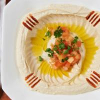 Hummus · Vegetarian. Mashed chickpeas, lemon juice, tahini sauce, special spices, topped with olive o...