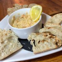 Artichoke & Spinach Dip · Gluten-sensitive. Served with Parmesan and warm tortilla chips.