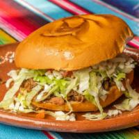 Tortas · Torta served with choice of meat, beans, lettuce, tomatoes, cheese and sour cream.