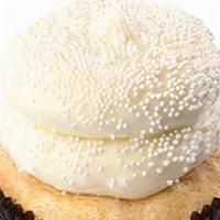 Wedding Cake (Gf) · Gluten free. Gluten friendly vanilla cake topped with buttercream and white pearl sprinkles.