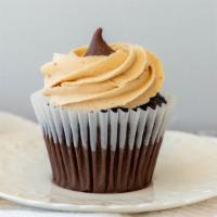 Peanut Butter Kiss · Chocolate cupcake topped with a layer of smooth semi sweet chocolate, a peanut butter butter...