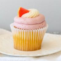 Raspberry Lemonade · Vanilla cupcake topped with a layer of raspberry buttercream and a swirl of lemon buttercrea...