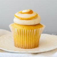 Salty Carmella · Vanilla cupcake filled with salted caramel sauce, topped with caramel buttercream, drizzled ...
