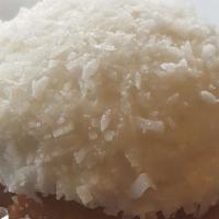 Let It Snow · Vanilla cupcake topped with white chocolate cream cheese icing and covered in fresh shredded...