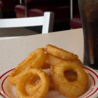 Onion Rings · Thick-cut onion rings fried golden crispy.