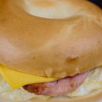 The Egger · Fried egg, choice of grilled ham, bacon or sausage patty with American cheese served on a gr...