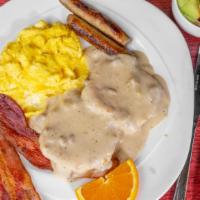 Mississippi Breakfast · Two eggs any style, two slices of bacon, two sausage links and a biscuit topped with sausage...