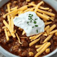 Bison Chili · Ground bison, chili beans, roasted corn & peppers, garnished with cheddar & sage crema. (cal...