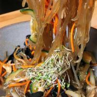Stir Fry Glass Noodle (Japchae) · Stir fry glass noodle cooked with soy sauce, zucchini, carrot, onion, and mushroom.