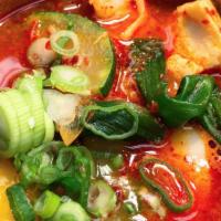 Soft Tofu Stew Noodle · Spicy stew cooked with wheat noodle, squid, silken tofu, zucchini, and onions with a drop of...