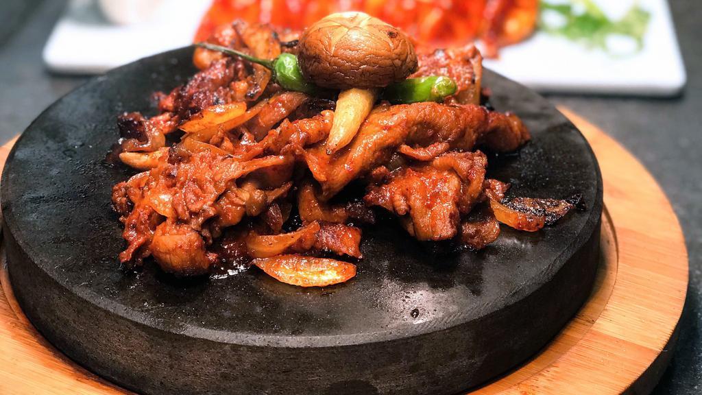 Pork Bulgogi · Thinly sliced pork shoulder, marinated in sweet&spicy sauce, then grilled with mushrooms, onions, and scallions.