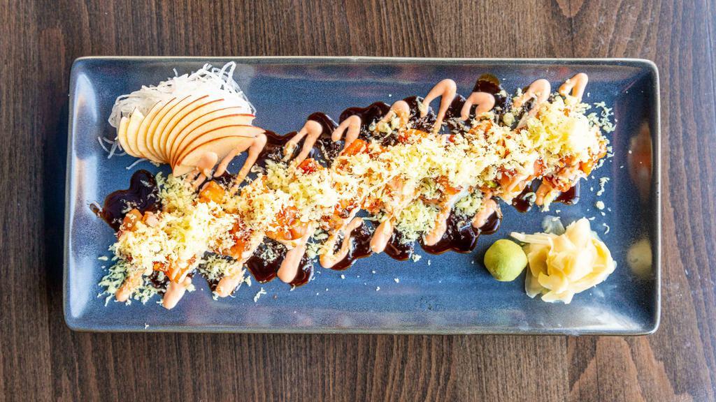 Hot Knight Roll* · Spicy tuna, shrimp tempura, cucumber, avocado, wrapped with dynamite mix, topped with tempura flakes, spicy mayo and eel sauce (8pc)