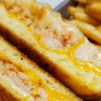 Lobster Grilled Cheese · Trio of cheese with garlic aioli served on toasted Texas Toast