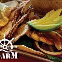 Grilled Cajun Avocado Sandwich · Grilled chicken breast topped with fresh avocado and caramelized onions.