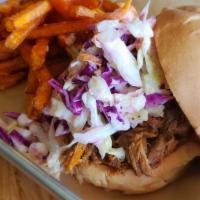 Pulled Pork Sandwich · Pulled pork topped with house slaw.
