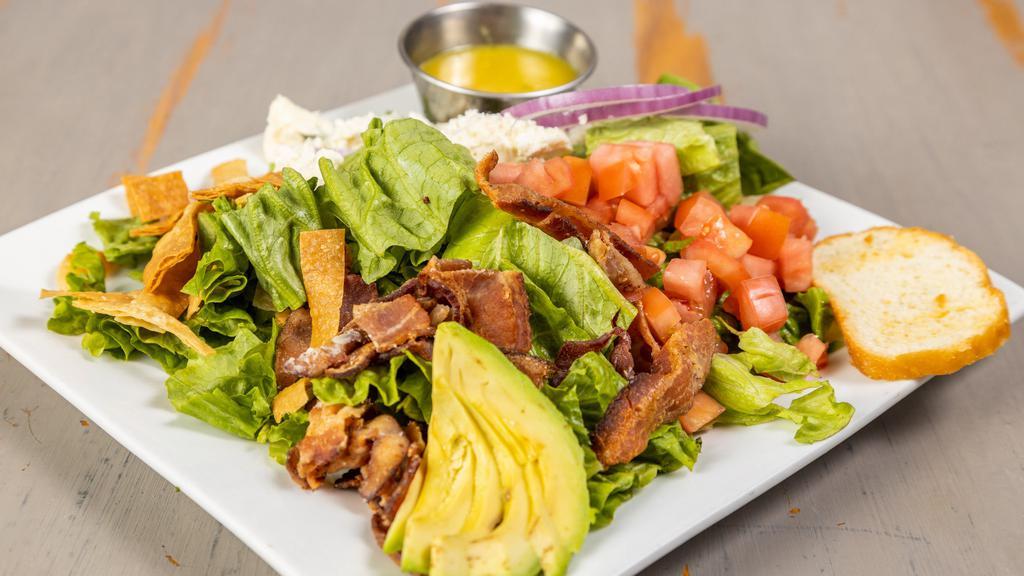 Bleu Blt Salad · Bleu cheese, bacon, tomato and onion tossed in homemade honey mustard, topped with avocado and tortilla strips.