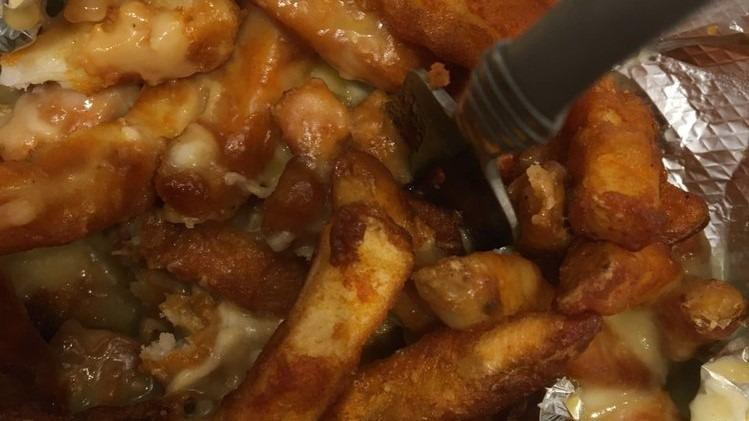 Gravy & Cheese Fries · Covered with gravy and cheese.